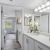 a spacious bathroom with a toilet and a sink